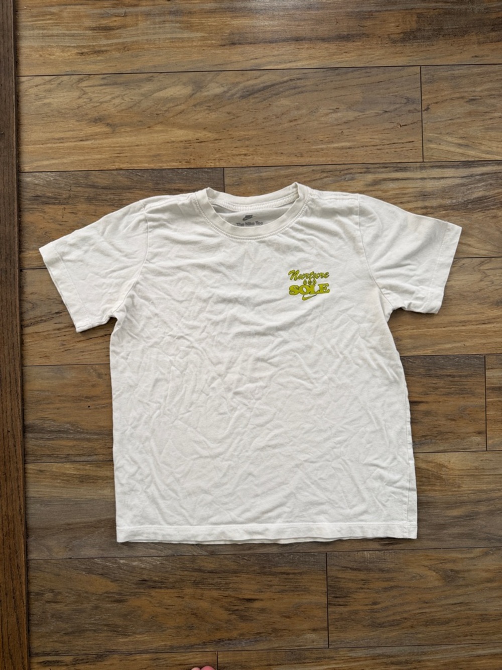 Nike White Tee with Lime Green 'Nurture the SOLE' Graphic